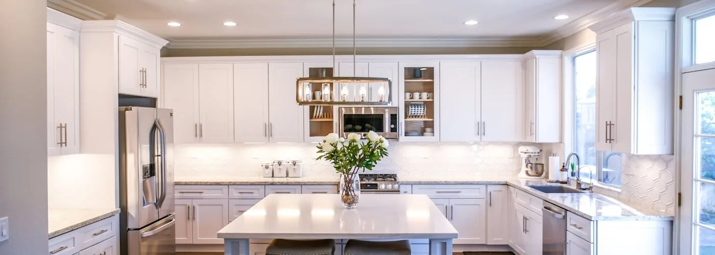 Bright white kitchen with island and pendant lighting, Hillsborough full remodel by Ridgeway