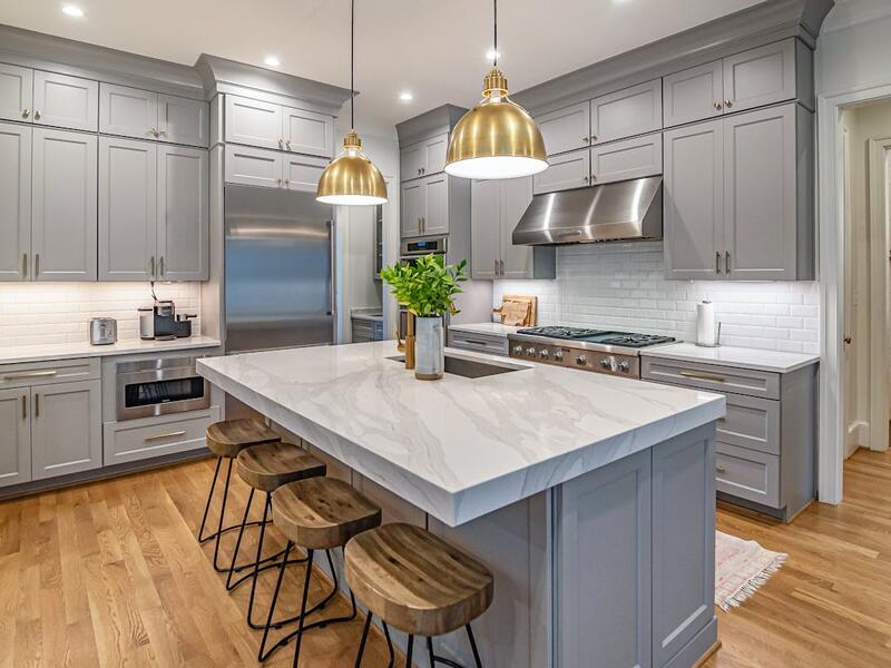 Modern kitchen with marble island and pendant lights, Meadowmont remodel by Ridgeway