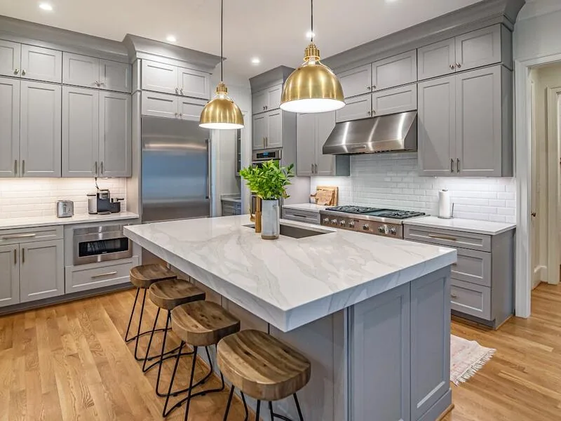 Modern kitchen with marble island and pendant lights, Meadowmont remodel by Ridgeway